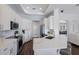 Bright kitchen featuring white cabinetry, stainless steel appliances, quartz countertops, and ample storage at 8223 Snowy Egret Pl, Bradenton, FL 34202