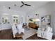 Spacious living room featuring an open floorplan, white couches, and modern decor at 8223 Snowy Egret Pl, Bradenton, FL 34202