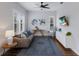 Cozy living room featuring modern furniture, stylish decor, and plantation shutters at 8223 Snowy Egret Pl, Bradenton, FL 34202