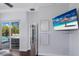 Bright main bedroom showcasing sliding glass doors leading to a beautiful pool and outdoor area at 8223 Snowy Egret Pl, Bradenton, FL 34202