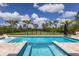 Inviting backyard pool with stylish lounge chairs and lush landscaping provides a private, resort-like experience at 8223 Snowy Egret Pl, Bradenton, FL 34202