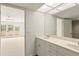 Well-lit bathroom vanity next to bedroom entrance and bedroom balcony at 825 S Osprey Ave # 302, Sarasota, FL 34236