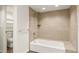 Modern bathroom featuring tile walls, soaking tub, and shower at 825 S Osprey Ave # 302, Sarasota, FL 34236