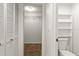 Bathroom with tiled floor and large shelving next to toilet at 825 S Osprey Ave # 302, Sarasota, FL 34236
