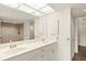 Bright bathroom featuring dual sinks, mirrored wall cabinet and shower at 825 S Osprey Ave # 302, Sarasota, FL 34236
