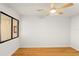 Bright bedroom with hardwood floors, ceiling fan, and a window providing lots of light at 825 S Osprey Ave # 302, Sarasota, FL 34236