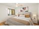 Bedroom features art and window with hardwood floors at 825 S Osprey Ave # 302, Sarasota, FL 34236