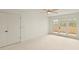 Bright bedroom features sliding doors to a sunny private balcony at 825 S Osprey Ave # 302, Sarasota, FL 34236