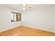Bedroom features hardwood floor and small window at 825 S Osprey Ave # 302, Sarasota, FL 34236