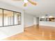 Open living area featuring hardwood floors, view to kitchen and sliding doors to a balcony at 825 S Osprey Ave # 302, Sarasota, FL 34236