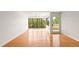 Bright living room featuring hardwood floors, large windows and a ceiling fan at 825 S Osprey Ave # 302, Sarasota, FL 34236