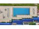 Aerial view of community pool with lounge seating and manicured greenery at 825 S Osprey Ave # 302, Sarasota, FL 34236