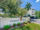 Entrance to Central Park with lush landscaping, mature trees, and manicured lawn at 825 S Osprey Ave # 302, Sarasota, FL 34236