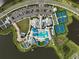 Aerial view of the resort-style pool complex, clubhouse, and tennis courts at 8313 Ocean Tides Cv, Parrish, FL 34219