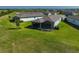 A lush backyard featuring a screened lanai providing a relaxing outdoor living space for the home at 8313 Ocean Tides Cv, Parrish, FL 34219