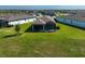 A spacious backyard featuring a screened lanai with seating, perfect for outdoor living and entertaining at 8313 Ocean Tides Cv, Parrish, FL 34219
