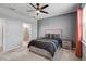 Spacious bedroom includes a walk-in shower and modern ceiling fan, providing comfort and style at 8313 Ocean Tides Cv, Parrish, FL 34219