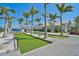 Community bocce ball court with lush landscaping and clear blue skies at 8313 Ocean Tides Cv, Parrish, FL 34219
