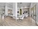 Bright cafe with modern tables and chairs, a TV, and a coffee bar, perfect for gatherings at 8313 Ocean Tides Cv, Parrish, FL 34219