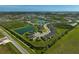 Aerial view of a community with ponds and lush green spaces, showcasing a serene environment at 8313 Ocean Tides Cv, Parrish, FL 34219