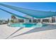 Beautiful community pool area with a covered sunshades, water features and ample seating at 8313 Ocean Tides Cv, Parrish, FL 34219