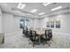 Well-lit conference room with modern seating, a large table, and neutral decor at 8313 Ocean Tides Cv, Parrish, FL 34219