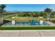Community entrance fountain featuring lush landscaping, palm trees, and a Del Webb sign at 8313 Ocean Tides Cv, Parrish, FL 34219
