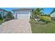 Beautiful single-Gathering home with a paver driveway, two-car garage and well manicured landscaping at 8313 Ocean Tides Cv, Parrish, FL 34219