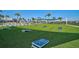 Community game lawn offering outdoor fun, featuring cornhole boards on manicured grass at 8313 Ocean Tides Cv, Parrish, FL 34219