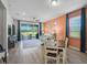 Comfortable living area with sliding glass doors to the backyard and a cozy seating arrangement at 8313 Ocean Tides Cv, Parrish, FL 34219