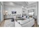 Serene lounge area featuring comfortable seating, tasteful decor, and ample natural light at 8313 Ocean Tides Cv, Parrish, FL 34219