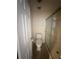 Compact bathroom with a stand-up shower and a modern toilet at 940 Byron Ct # 17C, Sarasota, FL 34243