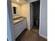 Bathroom featuring a granite countertop on the vanity and an adjacent toilet area at 940 Byron Ct # 17C, Sarasota, FL 34243