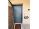 Close up of a front door with a small mail box and a 'blessed' welcome mat at 940 Byron Ct # 17C, Sarasota, FL 34243