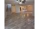 Spacious living room with open floor plan and modern ceiling fan at 940 Byron Ct # 17C, Sarasota, FL 34243