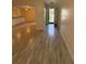 Open-concept living area with wood-look flooring, providing a spacious and airy atmosphere at 940 Byron Ct # 17C, Sarasota, FL 34243