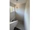 View of carpeted stairs and pendant light from above at 940 Byron Ct # 17C, Sarasota, FL 34243