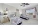 Bedroom with two twin beds and a ceiling fan at 5356 Mang Pl # 1404, Sarasota, FL 34238