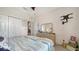Bright bedroom with closet and view to foyer at 5356 Mang Pl # 1404, Sarasota, FL 34238