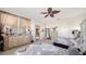 Spacious bedroom featuring dual beds, decorative ceiling fan, and neutral paint at 5356 Mang Pl # 1404, Sarasota, FL 34238