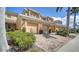 Beautiful townhouse featuring brick paved driveways, two-car garages, and tropical landscaping at 5356 Mang Pl # 1404, Sarasota, FL 34238