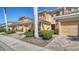 A row of townhouses with brick paver driveways and manicured landscaping at 5356 Mang Pl # 1404, Sarasota, FL 34238
