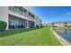 Spacious screened lanai overlooking the lush green lawn and serene pond at 5356 Mang Pl # 1404, Sarasota, FL 34238