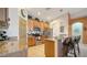Bright kitchen with granite countertops, bar seating, and stainless steel appliances at 5356 Mang Pl # 1404, Sarasota, FL 34238