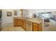 Open kitchen featuring stainless steel appliances and bright lighting at 5356 Mang Pl # 1404, Sarasota, FL 34238