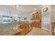Bright kitchen featuring stainless steel appliances and granite countertops at 5356 Mang Pl # 1404, Sarasota, FL 34238