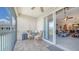 Screened lanai with comfortable seating overlooking the interior living space at 5356 Mang Pl # 1404, Sarasota, FL 34238