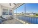 Relaxing screened lanai with pond views and comfortable seating at 5356 Mang Pl # 1404, Sarasota, FL 34238