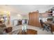 Spacious living room featuring a large built-in cabinet and a stylish desk at 5356 Mang Pl # 1404, Sarasota, FL 34238