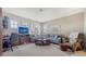 Bright living room showcasing large windows and relaxed seating arrangement at 5356 Mang Pl # 1404, Sarasota, FL 34238